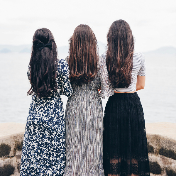 Loyalty program and rewards illustration - three women together on a beach